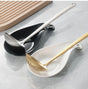 Kitchen spoon rest and ladle holder with drip tray for spoons, ladles, spatulas and cooking utensils.