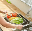 Expandable stainless steel over-the-sink drain basket for washing and draining fruits, vegetables, dishes and kitchen utensils.