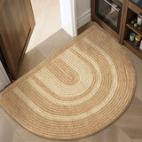 Half-circle braided rug on a wooden floor in a kitchen setting