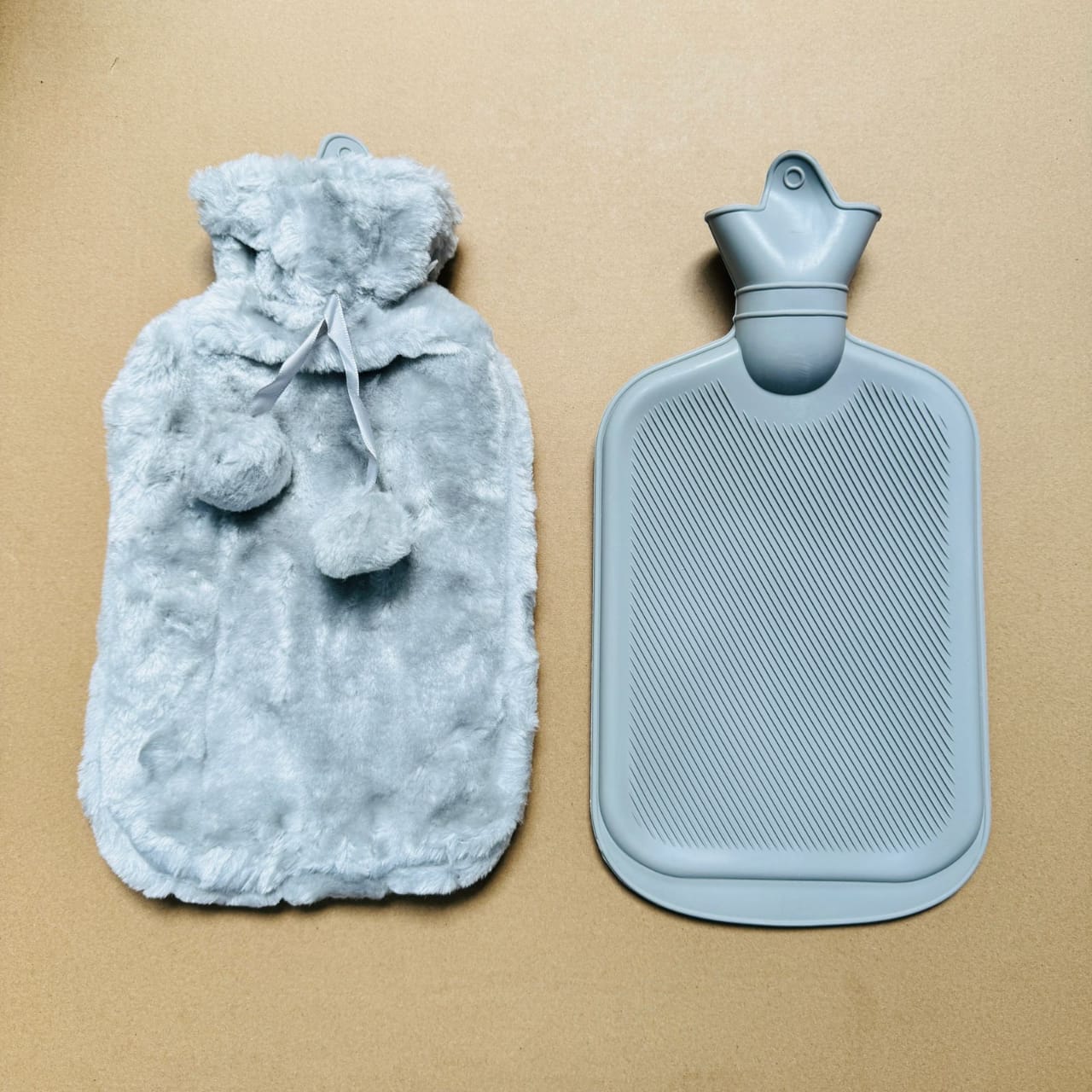grey hot water bottle with a free fleece cover 2liters