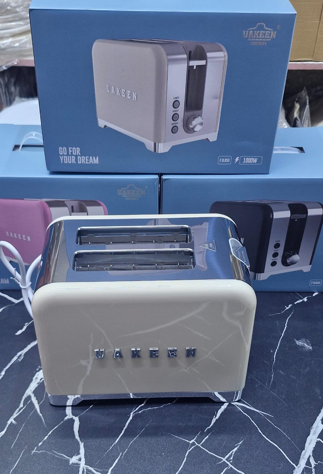 UAKEEN Germany 1000W 2-slice retro toaster in matte black with chrome trim, cancel reheat and defrost function buttons and browning level dial