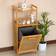 Bamboo laundry hamper with a removable fabric laundry basket and two-tier storage shelves, ideal for organizing laundry, toiletries, towels, and bathroom essentials.
