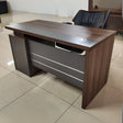 Wooden Office Desk – 1.2M with 3 Drawers

Size: 1.2 meters – ideal for compact office or home use

Material: Made from durable engineered wood with a smooth laminate finish

Storage: Comes with 3 spacious drawers for organizing files and stationery

Design: Modern style with a cable grommet hole for tidy wiring

Color: Rich walnut brown top with contrasting grey panel front

Perfect for both professional and personal workspaces.