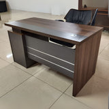 Wooden Office Desk – 1.2M with 3 Drawers

Size: 1.2 meters – ideal for compact office or home use

Material: Made from durable engineered wood with a smooth laminate finish

Storage: Comes with 3 spacious drawers for organizing files and stationery

Design: Modern style with a cable grommet hole for tidy wiring

Color: Rich walnut brown top with contrasting grey panel front

Perfect for both professional and personal workspaces.