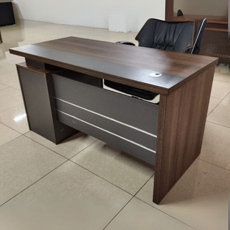 Wooden Office Desk – 1.2M with 3 Drawers

Size: 1.2 meters – ideal for compact office or home use

Material: Made from durable engineered wood with a smooth laminate finish

Storage: Comes with 3 spacious drawers for organizing files and stationery

Design: Modern style with a cable grommet hole for tidy wiring

Color: Rich walnut brown top with contrasting grey panel front

Perfect for both professional and personal workspaces.