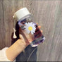 Transparent 450ml reusable water bottle with white leak-proof lid, daisy flower print, and carry strap for everyday hydration.