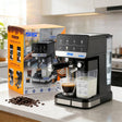 Espresso coffee maker DSP 20 bar black and stainless steel with milk frother tank, espresso cup and gift box on kitchen counter — iDecorators Kenya