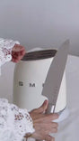 SMEG 6-Piece Knife Block Set in Cream with stainless steel knives including vegetable, utility, meat, santoku, bread and chef's knife in retro 50's style block