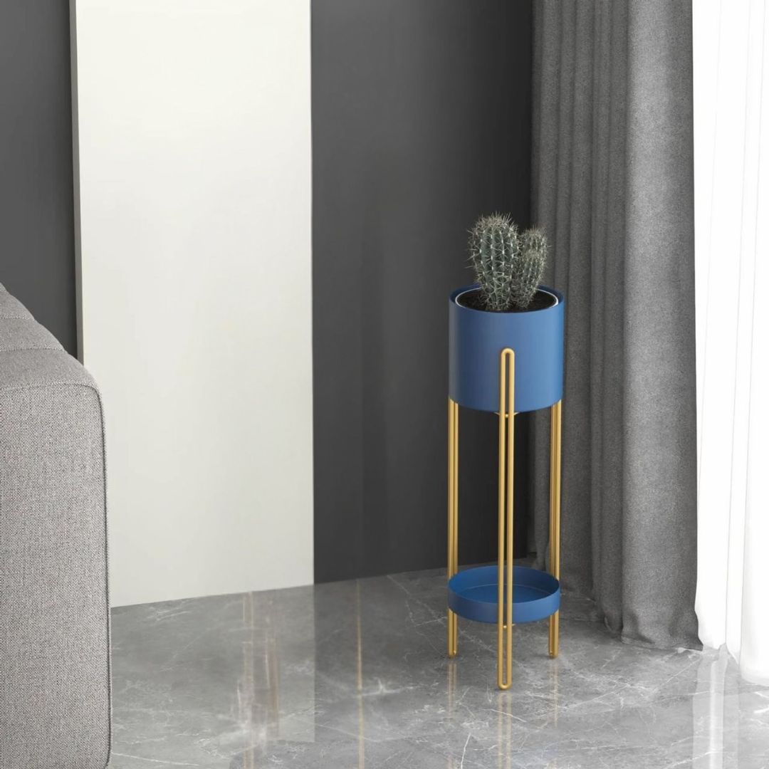 Blue plant stand with a cactus in a modern interior setting