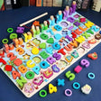Colorful alphabet and number puzzle on a blue surface with wooden sticks.