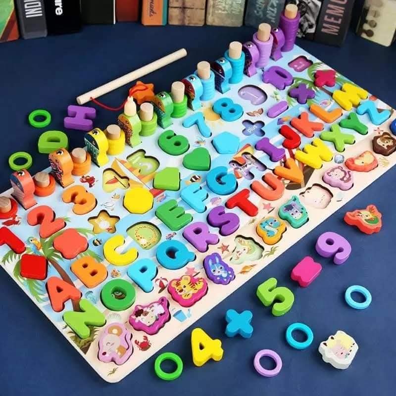Colorful alphabet and number puzzle on a blue surface with wooden sticks.